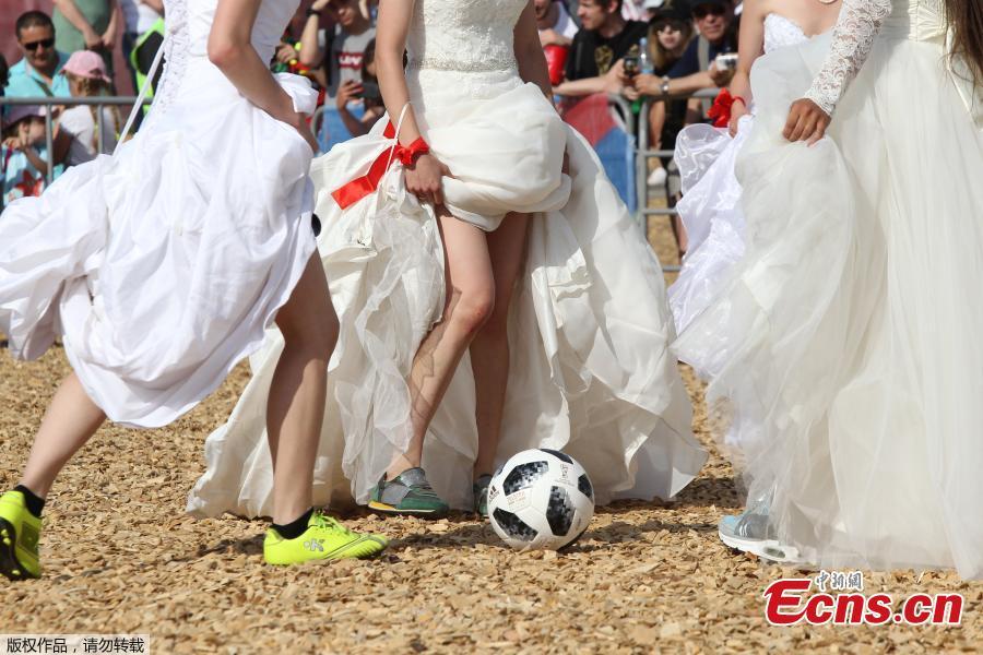 Women wearing wedding dresses take part in the so-called \