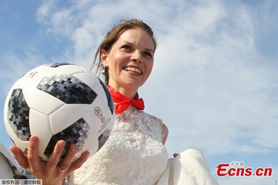 A woman wearing a wedding dress takes part in the so-called \