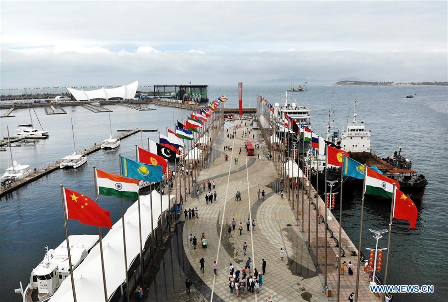 Visitors take a tour at the Olympic sailing center in Qingdao of east China\'s Shandong Province, July 1, 2018. The center, used as the conference hall during the 18th Shanghai Cooperation Organization (SCO) summit, after a brief remodification, was opened to the public from this Sunday. (Xinhua/Li Ziheng)