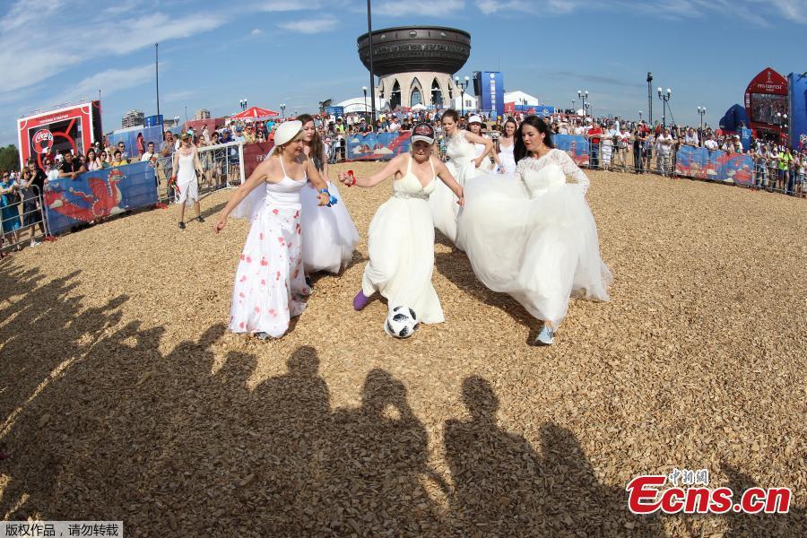 Women wearing wedding dresses take part in the so-called \
