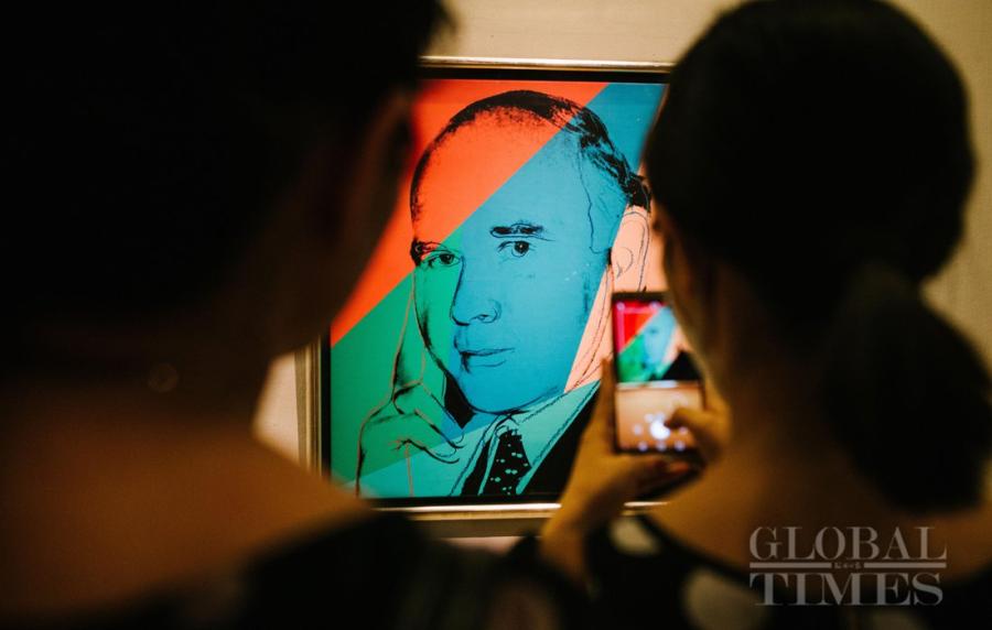 Visitors take photos of the International Art Collection at the National Art Museum of China in Beijing on June 29. The International Art Collection called \'Harmonious Co-Existence\', which runs until July 8, features over 200 artworks from more than 60 countries and regions. (Photo: Li Hao/GT)