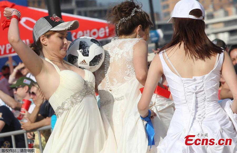 Women wearing wedding dresses take part in the so-called \