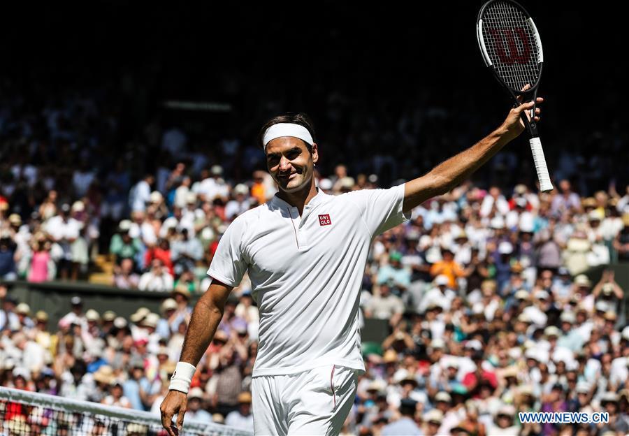 Roger Federer of Switzerland celebrates after winning the men\'s singles first round match against Dusan Lajovic of Serbia at the Championship Wimbledon 2018 in London, Britain, on July 2, 2018. Roger Federer won 3-0. (Xinhua/Tang Shi)
