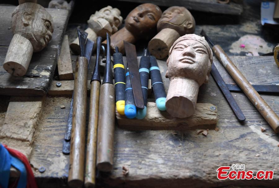 Tools used by folk artist Yang Yazhou to make puppet heads are displayed in his studio in Zhangzhou City, East China’s Fujian Province, July 1, 2018. Zhangzhou has a history of puppetry going back more than two thousand years. Yang represents the fifth generation of his family to be involved with Fuchun-style glove puppets show, an intangible cultural heritage. He began learning to carve puppet heads when he was nine years old, taught by several masters. Yang said it takes tens of steps to finish carving a puppet-head in about three days. Yang’s sister specializes in dressing the puppets, his brother in puppet performance. (Photo: China News Service/Zhang Bin)