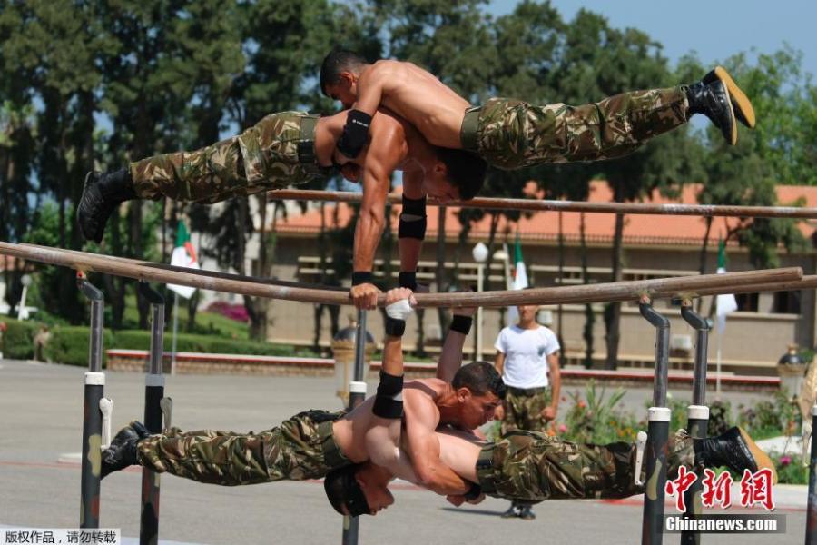 Soldiers demonstrate their skill during a military parade at the Cherchell \