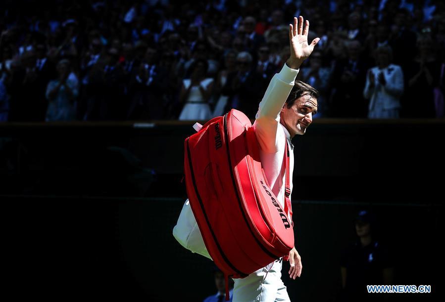 Roger Federer of Switzerland greets spectators after winning the men\'s singles first round match against Dusan Lajovic of Serbia at the Championship Wimbledon 2018 in London, Britain, on July 2, 2018. Roger Federer won 3-0. (Xinhua/Tang Shi)