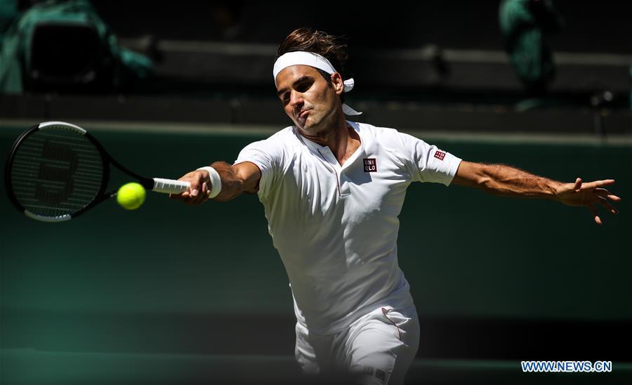 Roger Federer of Switzerland hits a return during the men\'s singles first round match against Dusan Lajovic of Serbia at the Championship Wimbledon 2018 in London, Britain, on July 2, 2018. Roger Federer won 3-0. (Xinhua/Tang Shi)