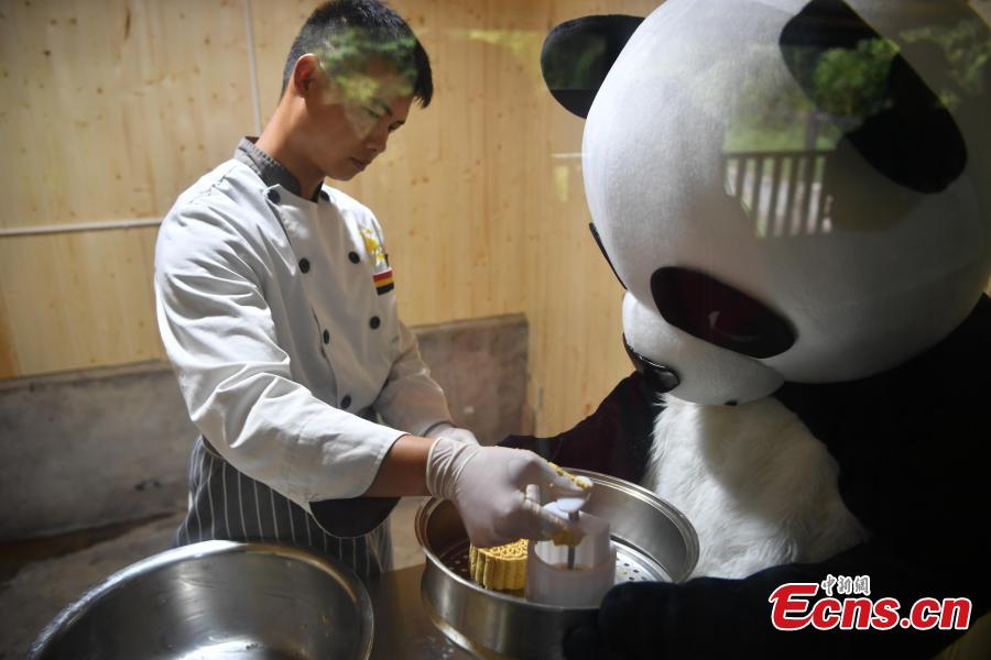 Keepers prepare food for giant pandas at the Yunnan Wildlife Park in Kunming City, Southwest China’s Yunnan Province, July 3, 2018. The park has opened a panda kitchen where visitors can see how keepers prepare food for the animals and also participate in the preparation process in the future. (Photo: China News Service/Liu Ranyang)
