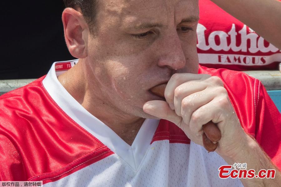 Joey Chestnut wins the annual Nathan\'s Hot Dog Eating Contest, setting a new world record by eating 74 hot dogs in Brooklyn, New York City, U.S., July 4, 2018. (Photo/Agencies)