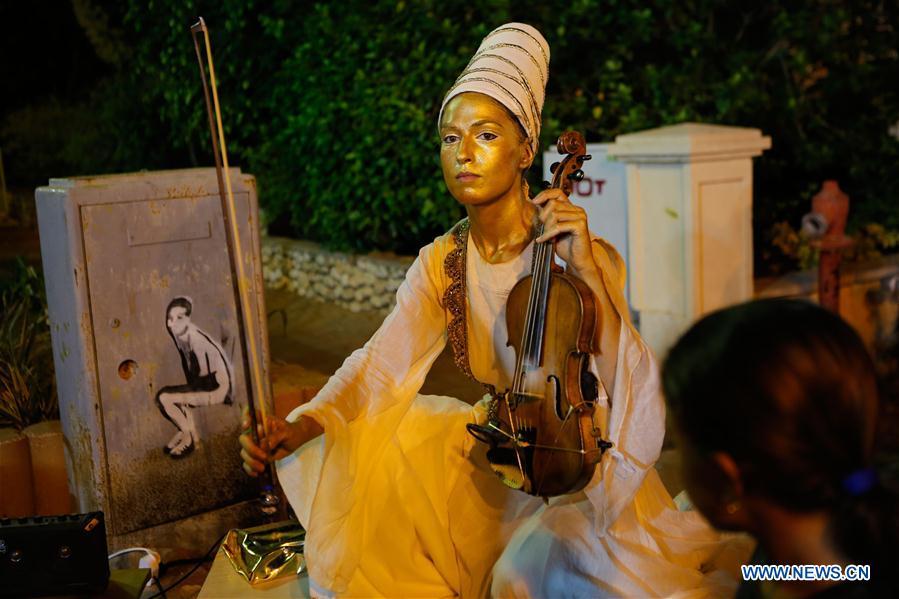 An artist performs during the International Festival of Living Statues in Rehovot, Israel, on July 4, 2018. The International Festival of Living Statues is held in Rehovot from July 3 to July 5. (Xinhua/Gil Cohen Magen)