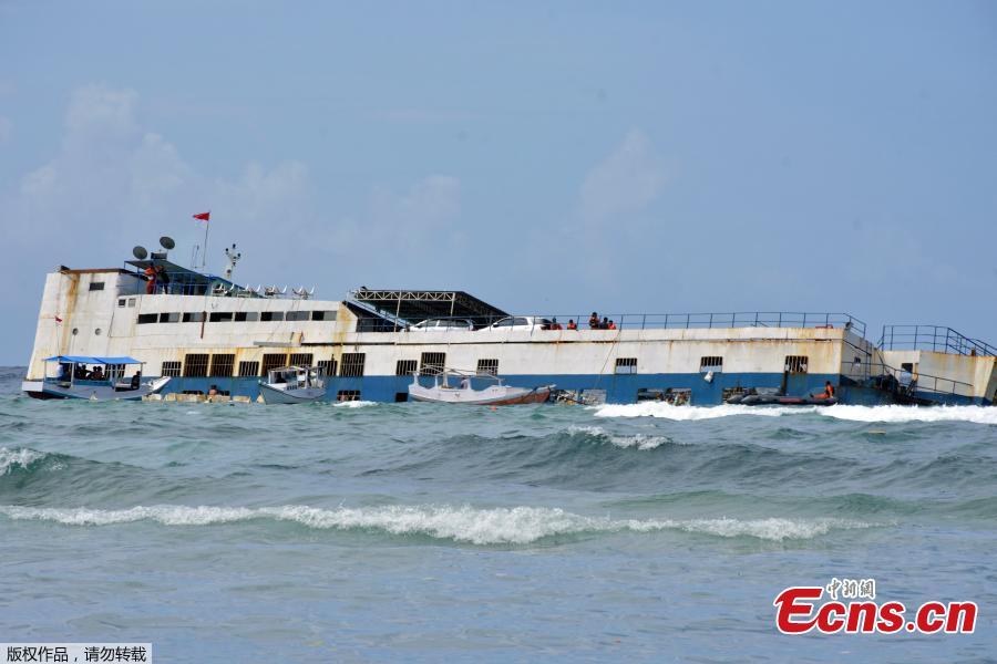 At least 34 people have been confirmed dead in a ferry sinking off the coast of Indonesia\'s South Sulawesi province on Tuesday, July 3, 2018. Images from the scene showed passengers in bright orange life vests clinging to the side of the KM Lestari Maju as it tilted sharply into the water not far from the coast of Bulukumba regency, near Selayar Island. Sutopo Purwo Nugroho, spokesman for Indonesia’s disaster management agency, said 155 people had managed to swim or be pulled to safety.(Photo/Agencies)