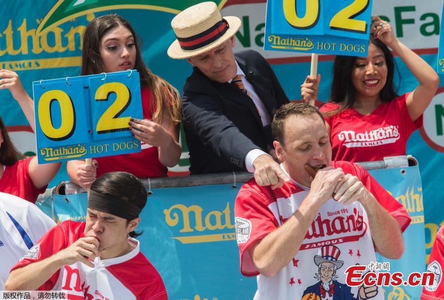 Joey Chestnut wins the annual Nathan\'s Hot Dog Eating Contest, setting a new world record by eating 74 hot dogs in Brooklyn, New York City, U.S., July 4, 2018. (Photo/Agencies)
