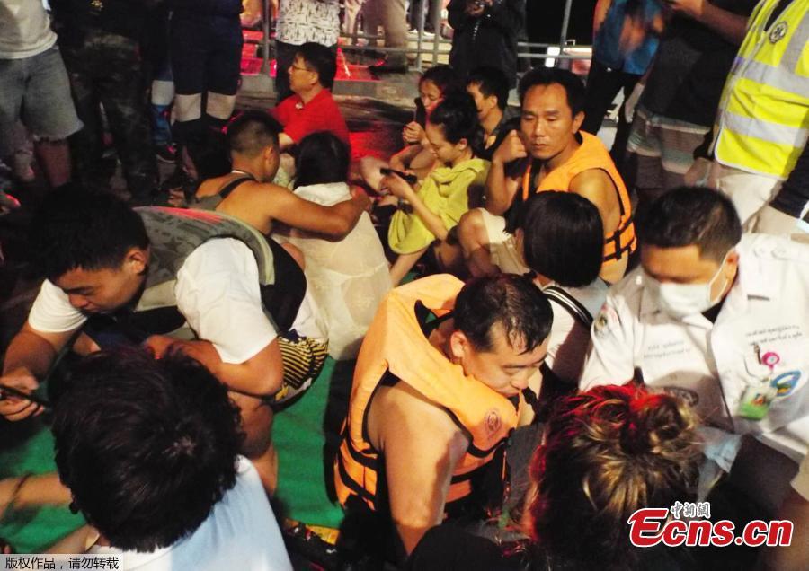 Rescued people in life jackets sit on a fishing boat after a boat they were travelling in capsized off the tourist island of Phuket, Thailand, July 5, 2018 in this still image taken from video.(Photo/Agencies)
