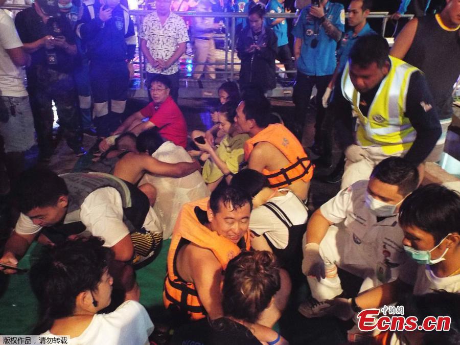 Rescued people in life jackets sit on a fishing boat after a boat they were travelling in capsized off the tourist island of Phuket, Thailand, July 5, 2018 in this still image taken from video.(Photo/Agencies)
