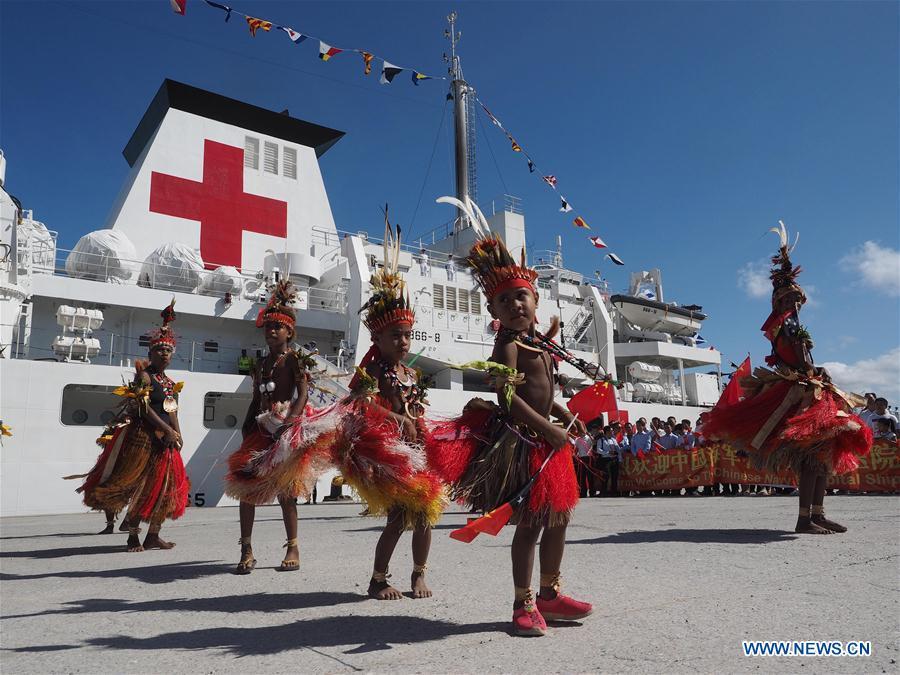 People perform traditional dance to welcome Chinese naval hospital ship Ark Peace in Port Moresby, Papua New Guinea, on July 11, 2018. Chinese naval hospital ship Ark Peace arrived in Papua New Guinea\'s capital Port Moresby on Wednesday, marking the start of its eight-day humanitarian mission in the Oceanian nation. (Xinhua/Jiang Shan)