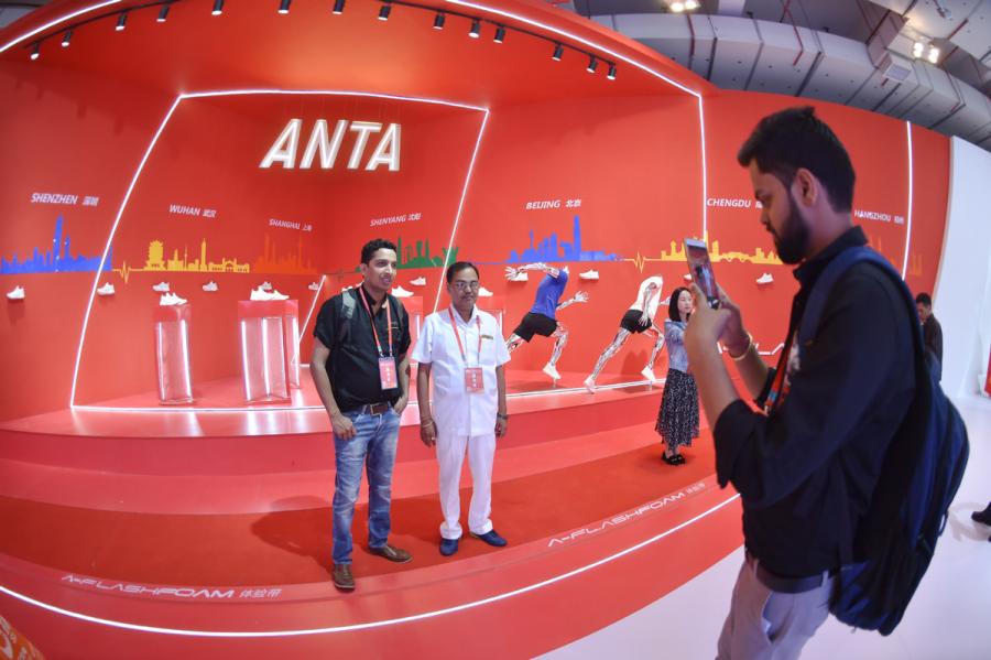 ndian businessmen pose for a photo at the Anta booth during an annual expo for the shoes and sports industry in Jinjiang, Fujian Province on April 19, 2018. (Photo/Xinhua)
As Anta has shown, China has been encouraging self-innovation and paying attention to intellectual property rights protection, experts said. Significant measures have produced recognized results, according to Vice-Minister of Commerce Wang Shouwen.
\