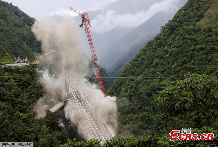 A view of Chirajara bridge at the Villavicencio city is seen during the controlled destruction, on July 11, 2018 in Bogota, Colombia. Implosion for the remains in the south part of the cable bridge was carried out with explosives. The bridge that was under construction was collapsed on January. Nine construction workers were died and eight were injured. (Photo/Agencies)