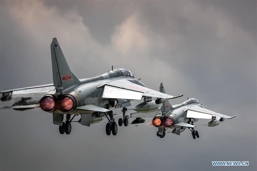 Two PLA air force JH-7A fighter-bombers are seen during a training module in preparation for the International Army Games on July 12, 2018. The Chinese People\'s Liberation Army (PLA) air force will send H-6K bombers, J-10A fighters, JH-7A fighter-bombers, IL-76 and Y-9 transport aircrafts, and a team of airborne troops to Russia to participate in the International Army Games 2018. It will be the first time that H-6K bombers and Y-9 transport aircraft have gone abroad to take part in military competitions.(Xinhua/Yang Pan)