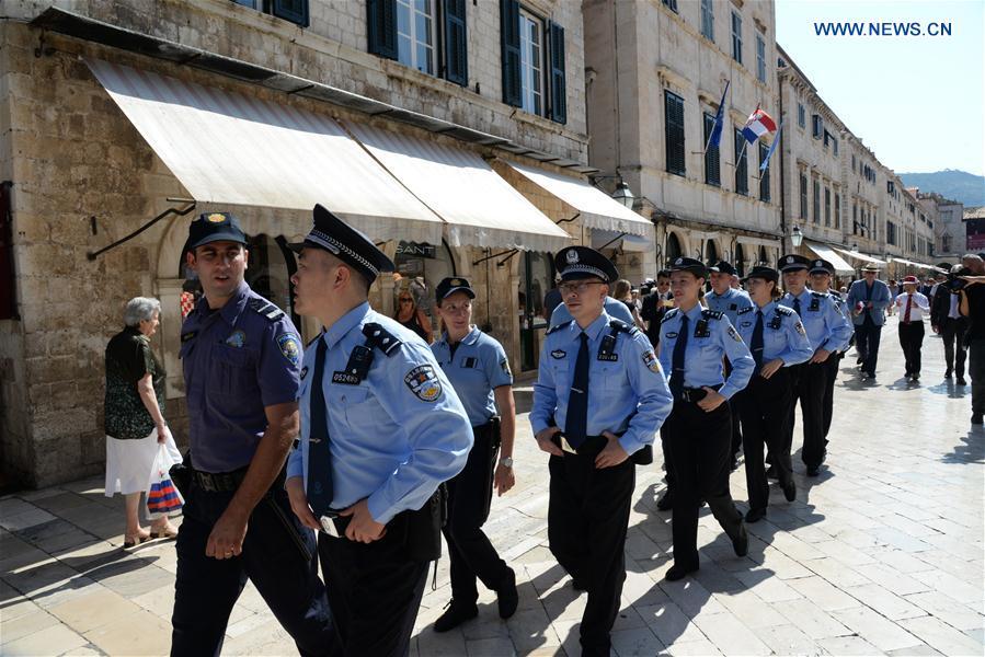 Chinese and Croatian police officers patrol after the launching ceremony of joint police patrol between China and Croatia in the Old Town of Dubrovnik, Croatia, on July 15, 2018. Six uniformed Chinese police officers started joint patrol with their Croatian counterparts here on Sunday. (Xinhua/Gao Lei)