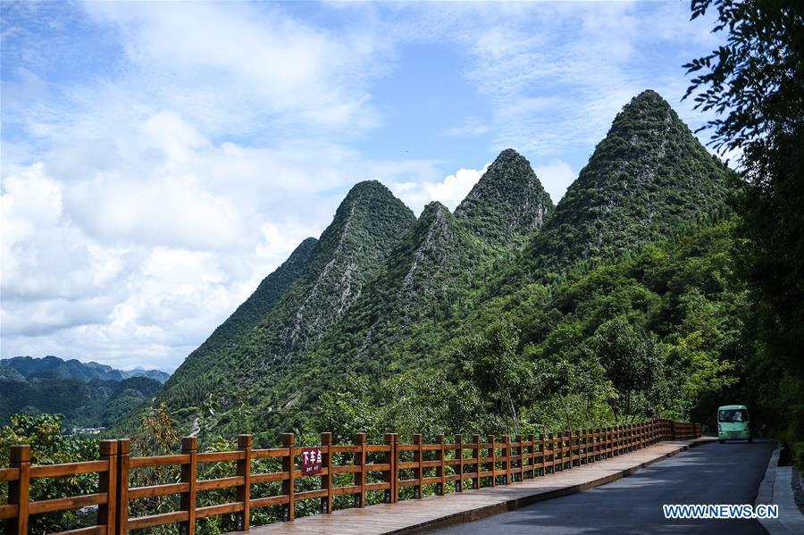 Photo taken on July 15, 2018 shows karst hills within the Wanfenglin scenic area in Xingyi, southwest China\'s Guizhou Province. (Xinhua/Tao Liang)
