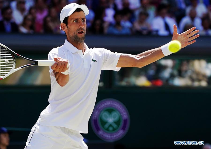 Novak Djokovic of Serbia hits a return during the men\'s singles final match against Kevin Anderson of South Africa at the Wimbledon Championships 2018 in London, Britain, on July 15, 2018. (Xinhua/Guo Qiuda)