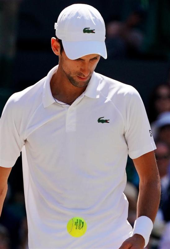 Novak Djokovic of Serbia prepares to serve during the men\'s singles final match against Kevin Anderson of South Africa at the Wimbledon Championships 2018 in London, Britain, on July 15, 2018. (Xinhua/Guo Qiuda)