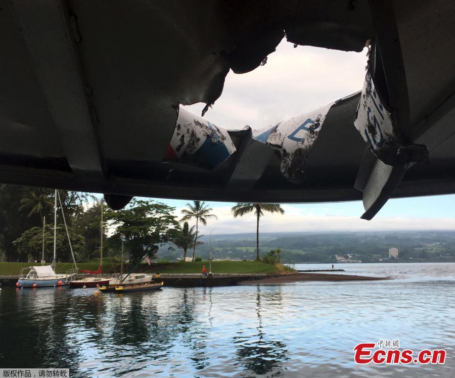 This photo provided by the Hawaii Department of Land and Natural Resources shows damage to the roof of a tour boat after an explosion sent lava flying through the roof off the Big Island of Hawaii Monday, July 16, 2018, injuring at least 23 people. The lava came from the Kilauea volcano, which has been erupting from a rural residential area since early May. (Photo/Agencies)