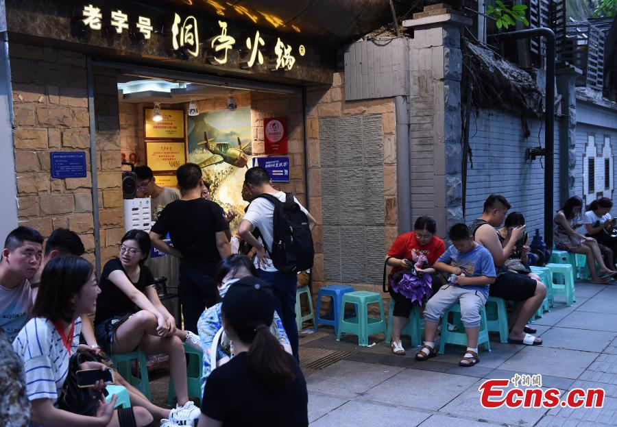 A popular hot pot restaurant inside a former air-raid shelter in Southwest China’s Chongqing Municipality, July 17, 2018. Authorities in Chongqing have allowed for the development of air-raid shelters, and they have been converted into wine cellars, restaurants and gas stations. The venues become especially popular in summer as it’s usually cool inside. (Photo: China News Service/Zhou Yi)