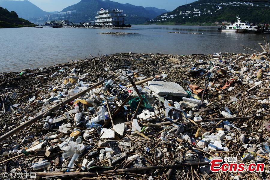 Garbage piles up on the banks of the Yangtze River after floodwaters subside in Yunyang County, Southwest China’s Chongqing Municipality, July 17, 2018. Over 1,500 tons of garbage were cleaned up a day. The Three Gorges Reservoir received a massive 60, 000 cubic meters of water a second after heavy rain in the upper reaches of the Yangtze River. Local authorities have warned more heavy rain and floods are expected to hit the Three Gorges Reservoir this year. (Photo/VCG)