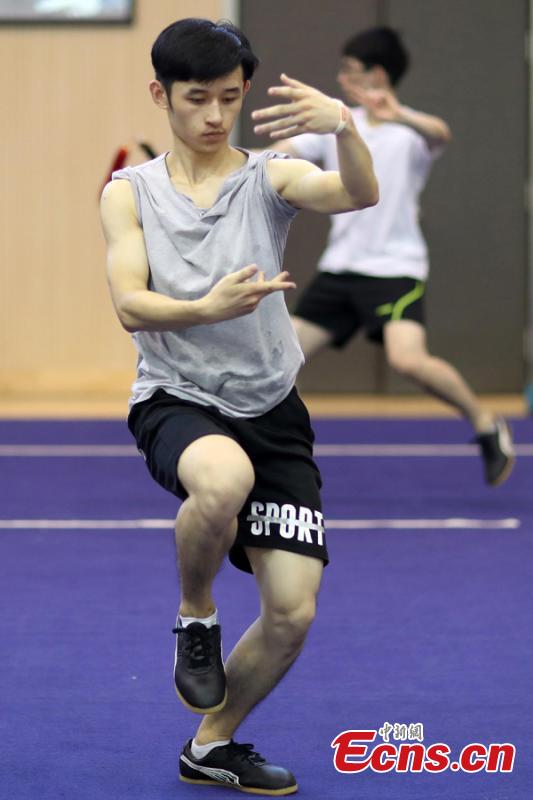 A member of the Nanjing Agricultural University Martial Arts Team trains for the upcoming China University Students Martial Arts Routine Championship in Nanjing City, East China’s Jiangsu Province, July 19, 2018, as temperatures hit approximately 35 degrees centigrade. (Photo: China News Service/Yang Bo)