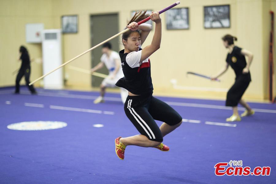 Members of the Nanjing Agricultural University Martial Arts Team train for the upcoming China University Students Martial Arts Routine Championship in Nanjing City, East China\'s Jiangsu Province, July 19, 2018, as temperatures hit approximately 35 degrees centigrade. (Photo: China News Service/Yang Bo)