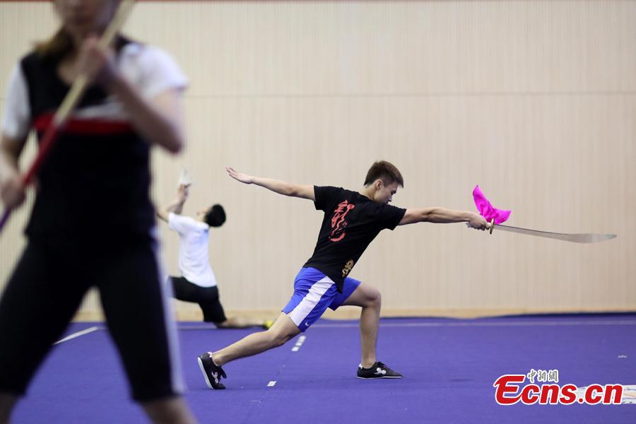 Members of the Nanjing Agricultural University Martial Arts Team train for the upcoming China University Students Martial Arts Routine Championship in Nanjing City, East China’s Jiangsu Province, July 19, 2018, as temperatures hit approximately 35 degrees centigrade. (Photo: China News Service/Yang Bo)