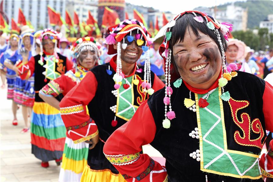 People celebrate black face festival in Qiubei county, Yunnan Province. (Photo/chinadaily.com.cn)
