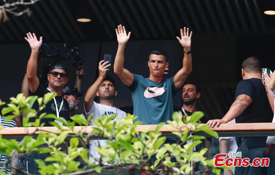 Portuguese professional footballer Cristiano Ronaldo waves to fans during a commercial activity in Beijing, July 19, 2018. (Photo: China News Service/Jia Tianyong)