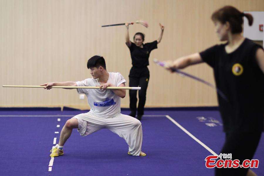 Members of the Nanjing Agricultural University Martial Arts Team train for the upcoming China University Students Martial Arts Routine Championship in Nanjing City, East China’s Jiangsu Province, July 19, 2018, as temperatures hit approximately 35 degrees centigrade. (Photo: China News Service/Yang Bo)