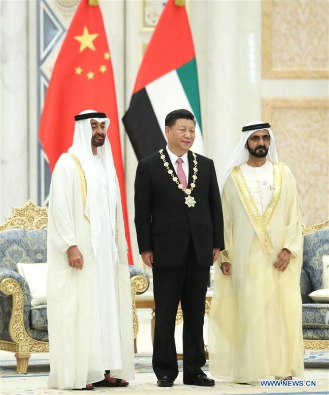 Chinese President Xi Jinping is conferred with the Order of Zayed, the UAE\'s highest civil decoration after talks with UAE Vice President and Prime Minister Sheikh Mohammed bin Rashid Al Maktoum and Crown Prince of Abu Dhabi Sheikh Mohammed bin Zayed Al Nahyan in Abu Dhabi, the United Arab Emirates (UAE), July 20, 2018. Xi arrived here on Thursday for a state visit to the UAE. (Xinhua/Pang Xinglei)