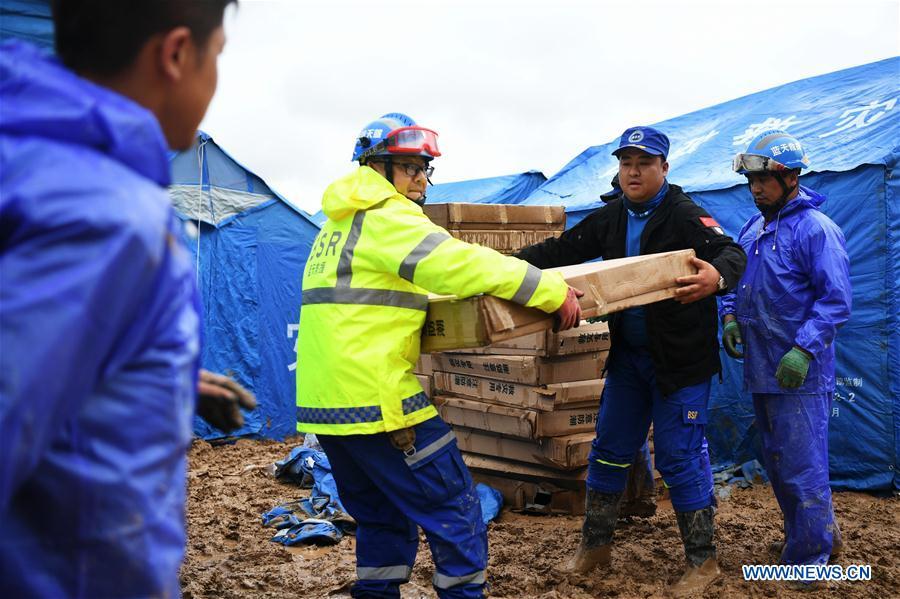 Rescuers convey disaster relief materials at flood-hit Chenhe Village of Dongxiang Autonomous County in Linxia Hui Autonomous Prefecture, northwest China\'s Gansu Province, July 20, 2018. About 1.08 million people in Gansu Province were affected by rain-triggered floods, with 12 deaths, four people missing and 27,000 people evacuated. (Xinhua/Chen Bin)