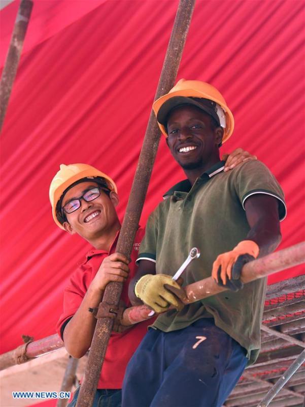 Workers from China and Senegal work in the National Wrestling Arena in Dakar, Senegal, on July 18, 2018. China is now Senegal\'s second largest trading partner and biggest source of financing. The National Grand Theater, the Museum of Black Civilization and the National Wrestling Arena, built with Chinese assistance, stand as important venues to carry forward the culture and traditions of Senegal. (Xinhua/Yan Yan)