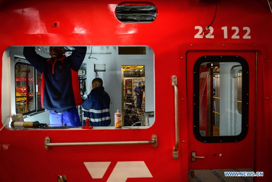 Chinese and South African technicians work inside of a locomotive to be assembled at the Transnet Engineering Koedoespoort Plant in Pretoria, South Africa, on July 27, 2017. In the past five years, China and African nations have deepened political mutual trust, mutual assistance in development and mutual learning in visions, and made concerted efforts in building the Belt and Road and a closer China-Africa community with a shared future. (Photo/Xinhua)