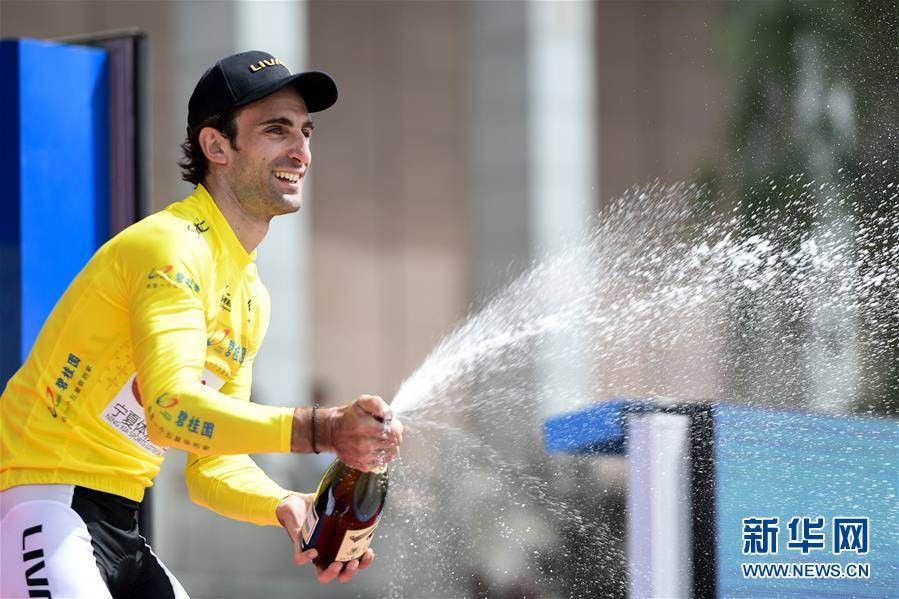 Georgios Bouglas of China\'s Ningxia Sports Lottery Livall Cycling Team (NLC) won the first stage of the Tour of Qinghai Lake in Xining, Northwest China\'s Qinghai Province, July 22, 2018. (Photo/Xinhua)