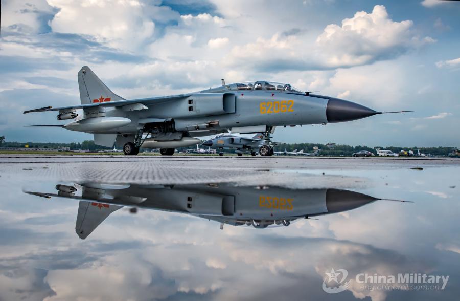 A JH-7A fighter bomber attached to the PLA Air Force arrives at the airport on July 20. All aircraft of the PLA Air Force to participate in the \