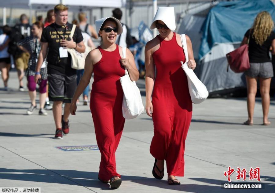 Fernanda Ambrosious, left, and Cristin Eleni, of San Diego, dress as characters from \