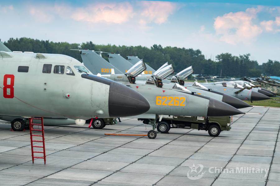 Multi-type aircrafts attached to the PLA Air Force sit on sit abreast on the flightline. All aircraft of the PLA Air Force to participate in the \