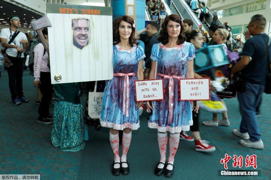 Samantha Sherman (R) and Gayle Hooker dressed as the twins from the movie The Shinning attends opening day of pop culture convention Comic-Con in San Diego, California, U.S., July 19, 2018. (Photo/Agencies)