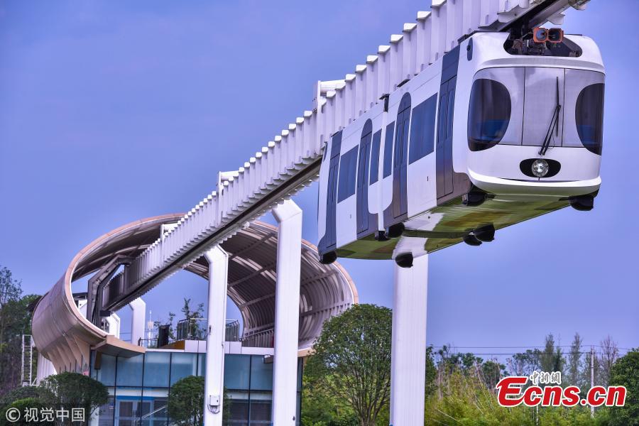 A suspension railway with carriages resembling pandas takes a trial run in Dayi County, Chengdu City, Southwest China’s Sichuan Province, July 21, 2018. Chengdu has announced it will start construction on an elevated monorail linking Dayi Station on the Chengdu?Pujiang Intercity Railway and Anren Town in Dayi County. The 11.2-kilometer-long tourist railway will have a total investment of 2.178 billion yuan ($321 million), with construction expected to be complete in 17 months. Chengdu will experiment with the ‘sky train’ project while promoting its transportation network. (Photo/VCG)