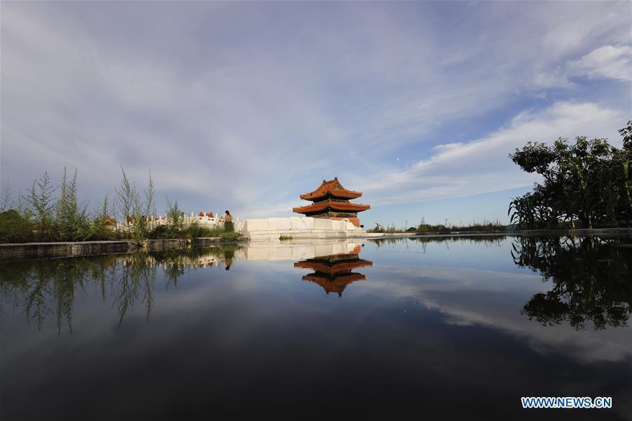 Photo taken on July 24, 2018 shows a stele tower and its water reflection at Dongling Imperial Mausoleum scenic spot in Zunhua City, north China\'s Hebei Province. (Xinhua/Liu Mancang)