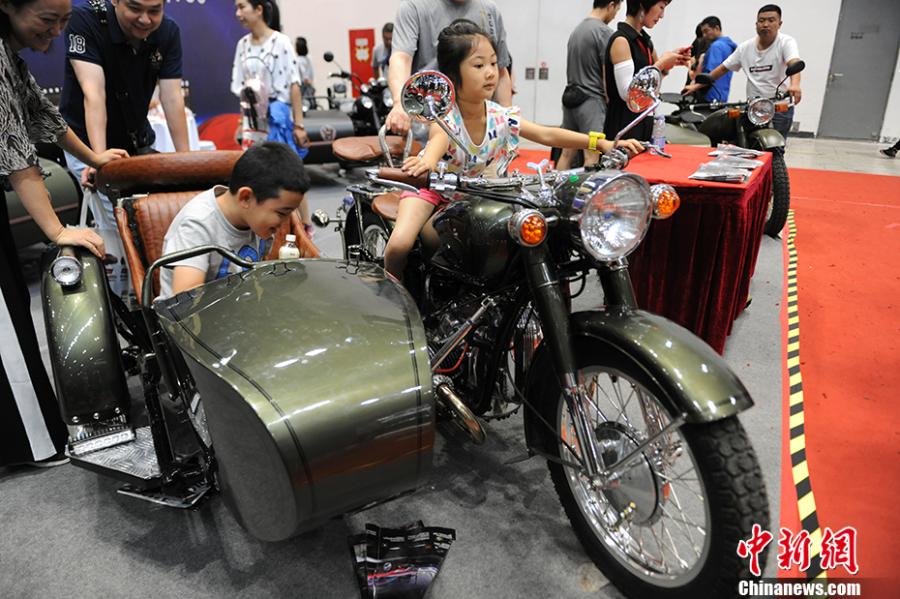 Photo taken on July 28- 29, 2018 shows a motorcycle exhibition held at the China National Convention Center in Beijing. Organized by an online auto platform, the fair displayed hundreds of motorcycles from home and abroad, such as the Ducati 959 sport bike, vintage Changjiang 650 sidecar, the Harley-Davidson WLA produced to the U.S. Army during the World War II and Benelli Leoncino bike. (Photo: China News Service/Fu Yu)