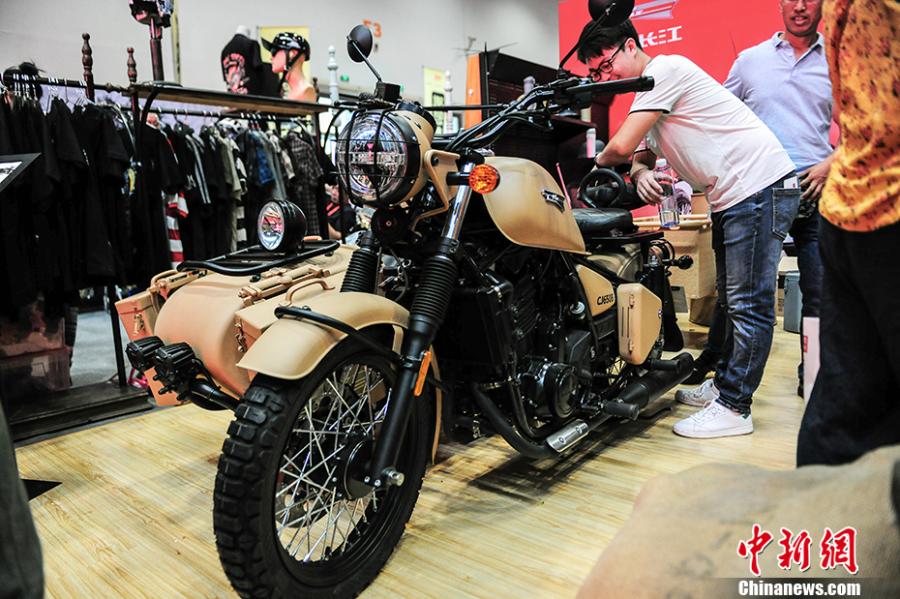 Photo taken on July 28- 29, 2018 shows a motorcycle exhibition held at the China National Convention Center in Beijing. Organized by an online auto platform, the fair displayed hundreds of motorcycles from home and abroad, such as the Ducati 959 sport bike, vintage Changjiang 650 sidecar, the Harley-Davidson WLA produced to the U.S. Army during the World War II and Benelli Leoncino bike. (Photo: China News Service/Fu Yu)