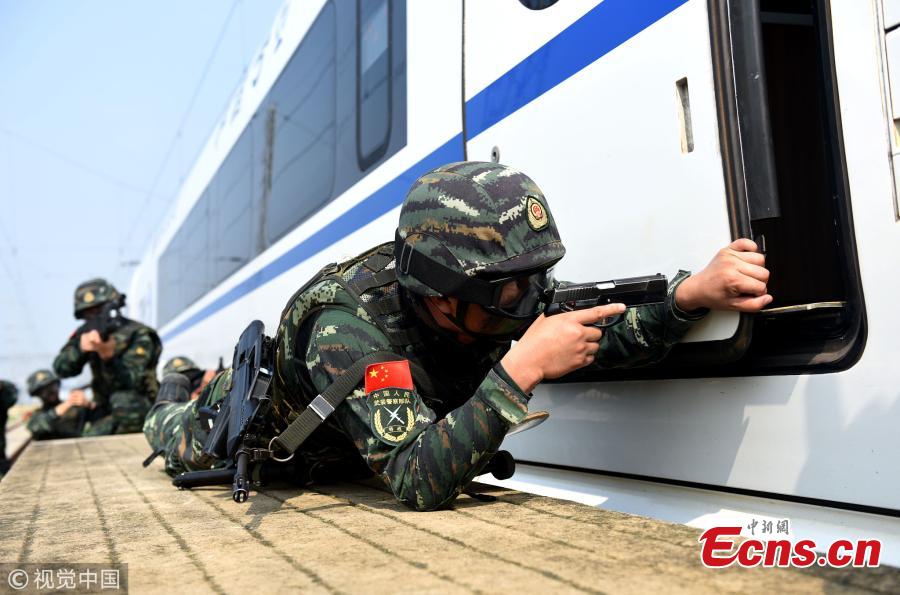 Armed police officers take part in a drill that simulated a hostage-taking crisis on a high-speed train in Hefei City, East China’s Anhui Province, July 30, 2018. The drill aimed to enhance preparedness against transportation emergencies. (Photo/VCG)