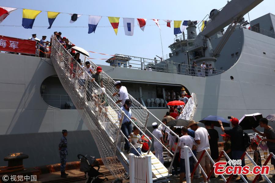 People visit the amphibious dock landing ship Jinggangshan of the PLA Navy in Quanzhou, Fujian Province, July 30, 2018, as the \